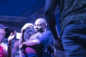 King Promise hugs a girl at Republic Hall Artiste night 