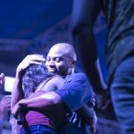 King Promise hugs a girl at Republic Hall Artiste night